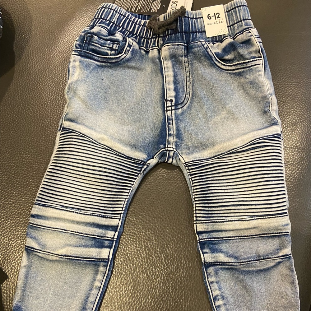 2 jeans pants, one blue and one cream. Size 6-12 months. New with tags.